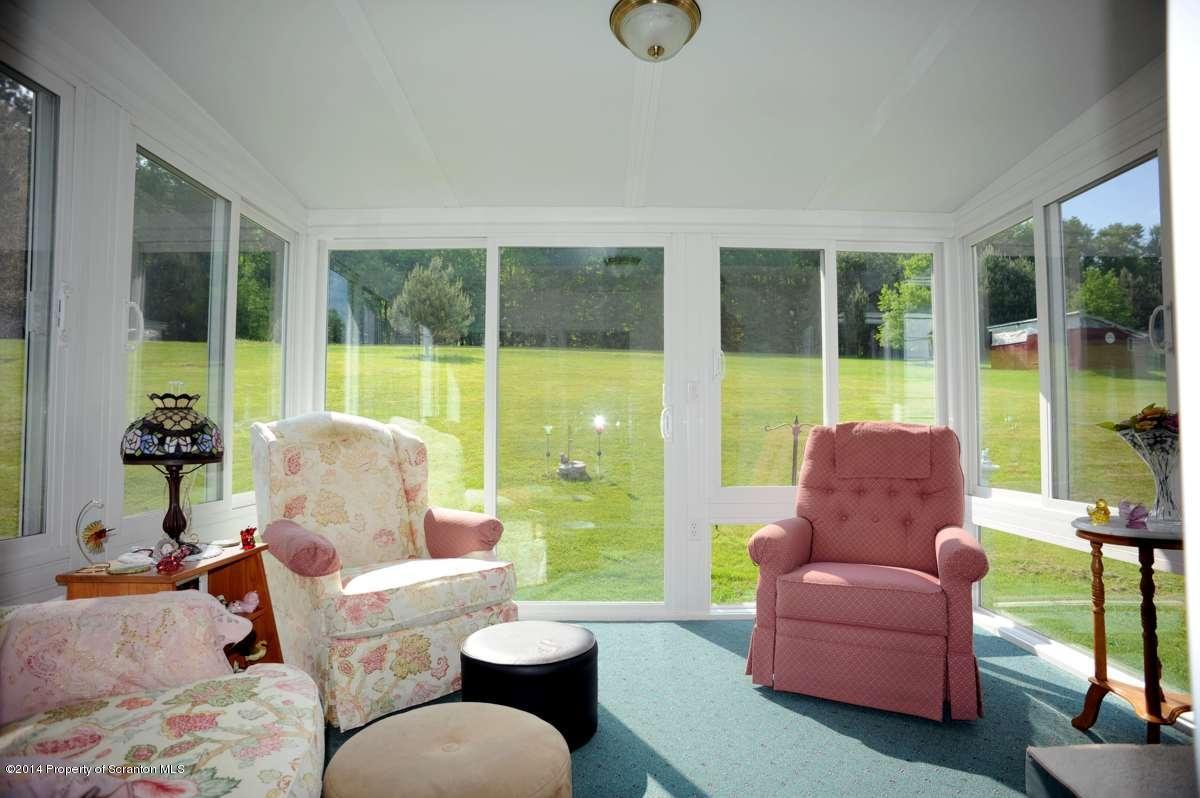 365 State Rte 2035 Nicholson, PA 18446 - Photo 4 of 28 a living room with furniture and a large window