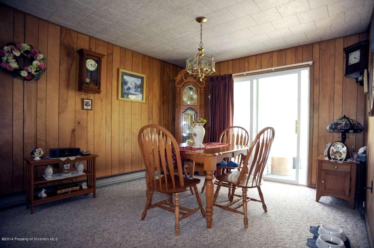 365 State Rte 2035 Nicholson, PA 18446 - Photo 5 of 28 a view of a dining room with furniture window and wooden floor