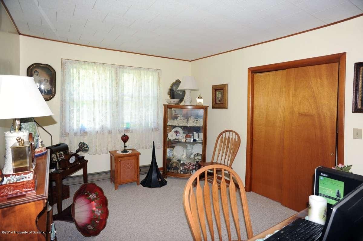 365 State Rte 2035 Nicholson, PA 18446 - Photo 8 of 28 a bedroom with furniture and a window