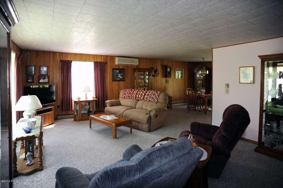 365 State Rte 2035 Nicholson, PA 18446 - Photo 10 of 28 a living room with furniture and a large window
