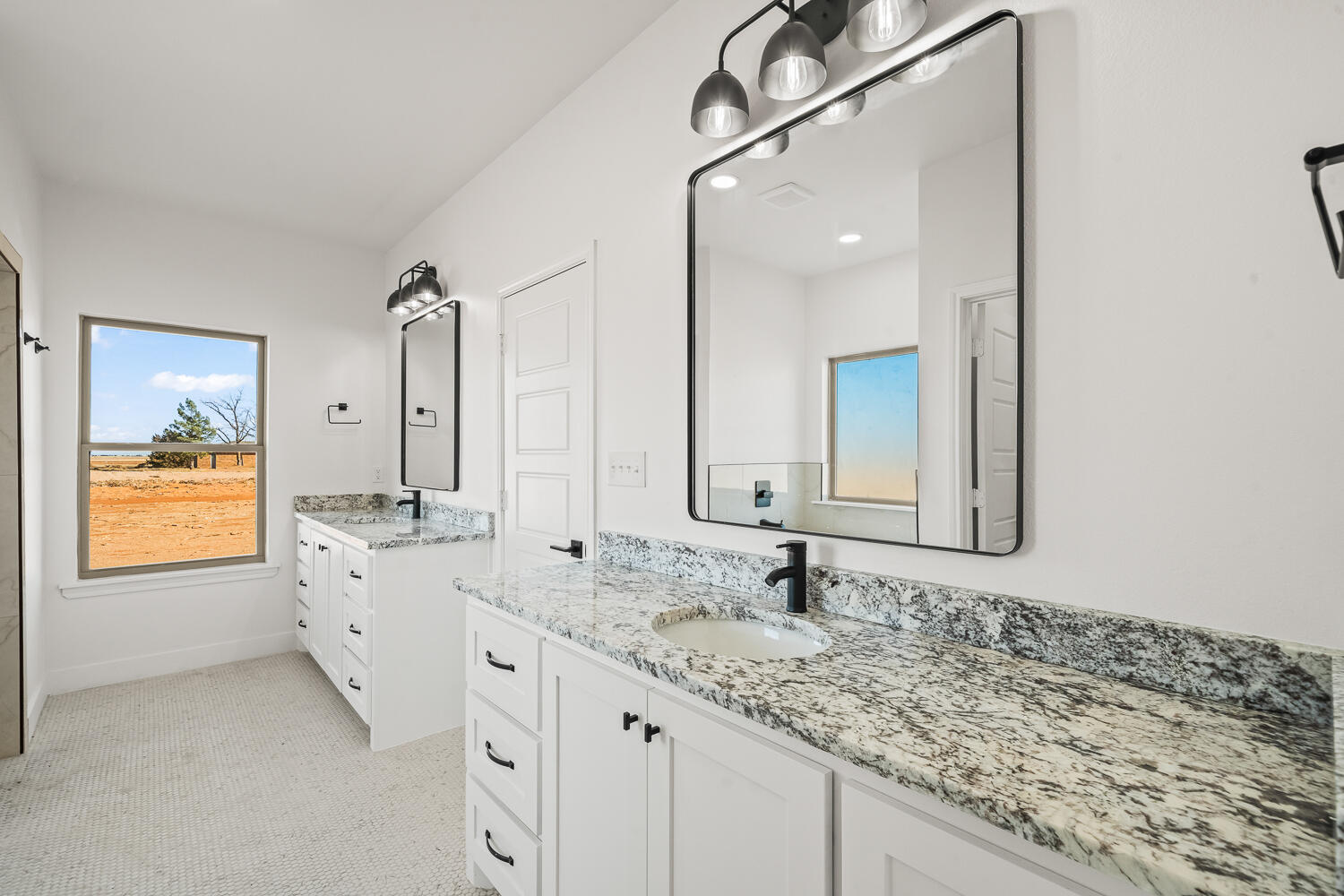 4062 Hawk Road Ropesville, TX 79358 - Photo 15 of 45 a bathroom with a granite countertop double vanity sink and mirror
