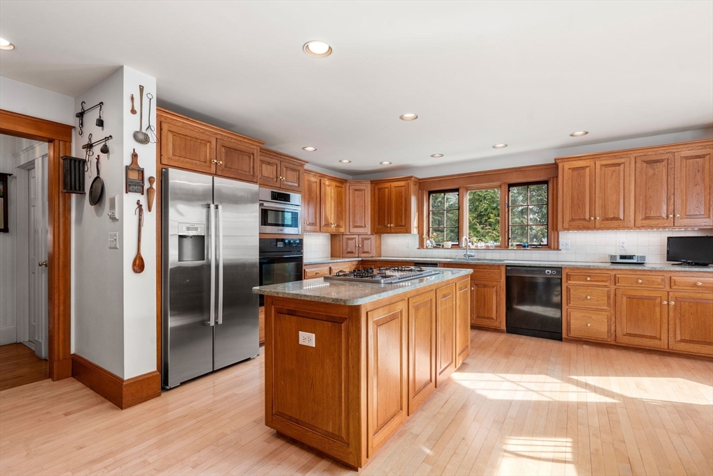 347 Manning Street Needham, MA 02492 - Photo 13 of 42 a kitchen with stainless steel appliances granite countertop a stove a refrigerator and a sink