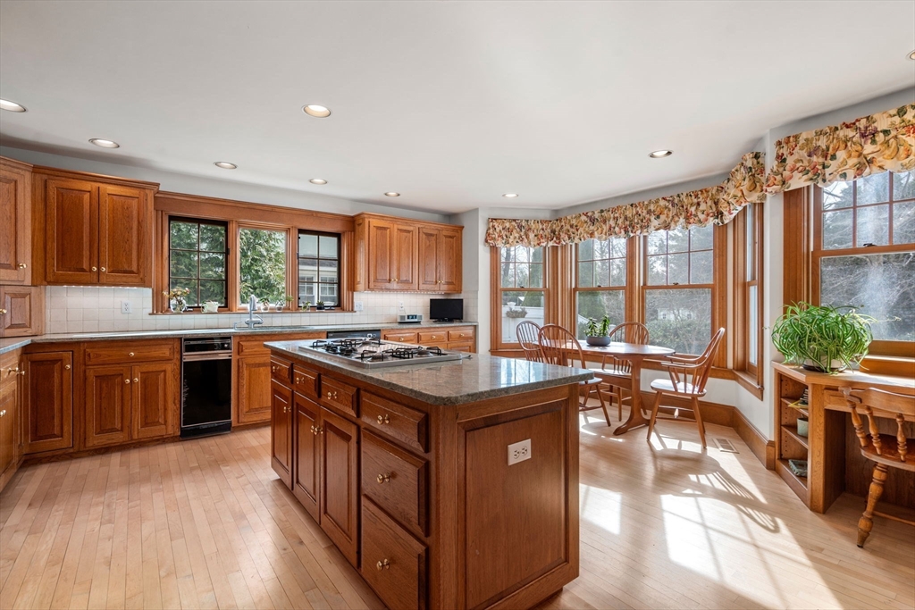 347 Manning Street Needham, MA 02492 - Photo 14 of 42 a kitchen with a stove and a refrigerator