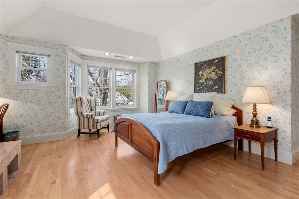 347 Manning Street Needham, MA 02492 - Photo 22 of 42 a bedroom with a bed a table and chair