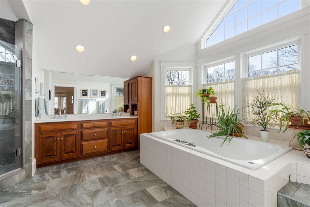 347 Manning Street Needham, MA 02492 - Photo 24 of 42 a spacious bathroom with a tub sink and mirror