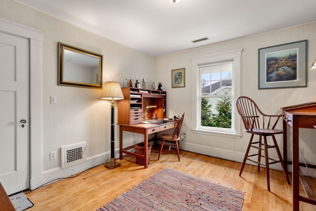 347 Manning Street Needham, MA 02492 - Photo 27 of 42 a work room with furniture and a wooden floor