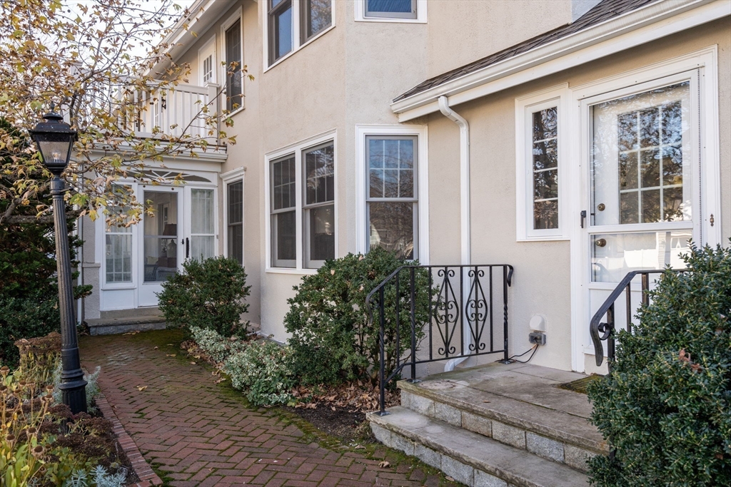 347 Manning Street Needham, MA 02492 - Photo 35 of 42 a front view of a house with a garden