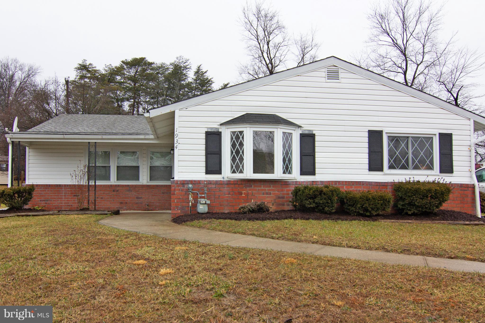 1934 Winder Road Windsor Mill, MD 21244 - Photo 1 of 31 a front view of a house with a garden