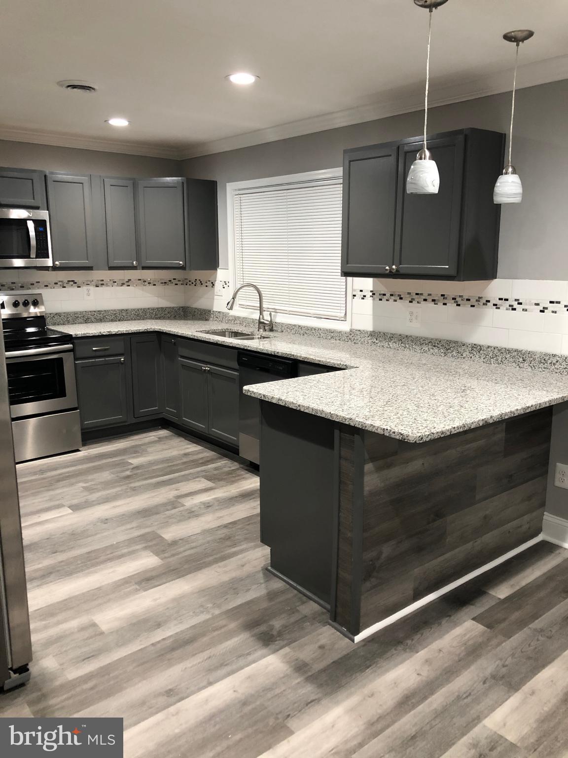 1934 Winder Road Windsor Mill, MD 21244 - Photo 2 of 31 a kitchen with a sink and cabinets