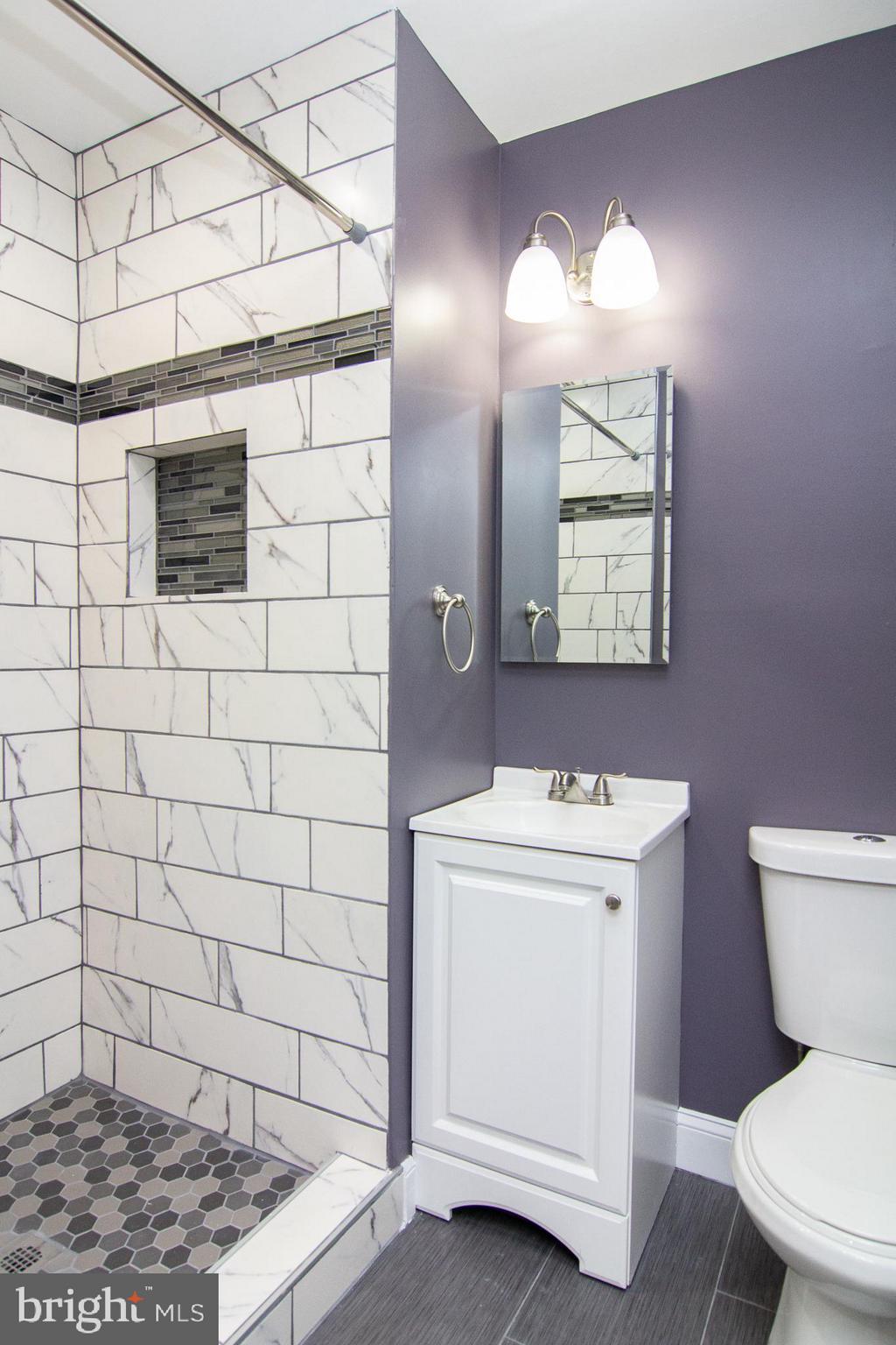 1934 Winder Road Windsor Mill, MD 21244 - Photo 23 of 31 a bathroom with a toilet sink and mirror