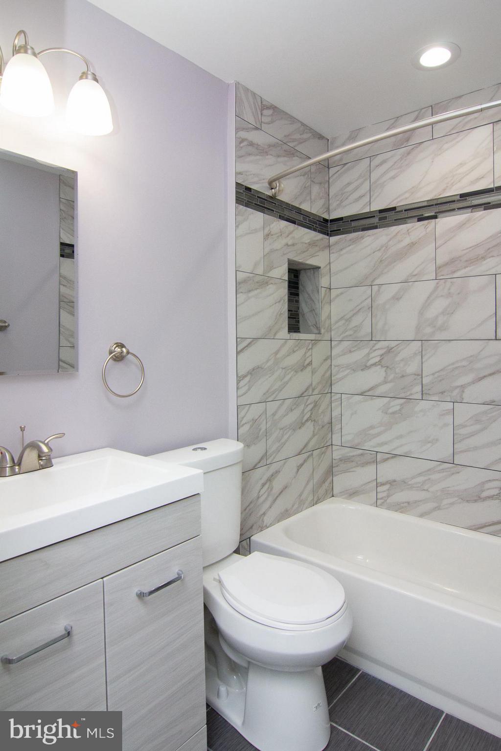 1934 Winder Road Windsor Mill, MD 21244 - Photo 27 of 31 a bathroom with a sink a toilet and shower