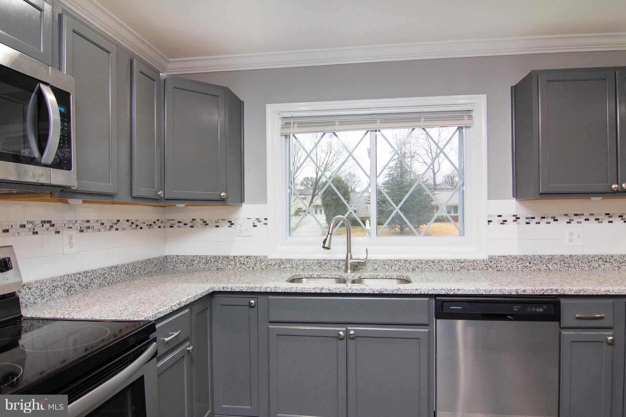 1934 Winder Road Windsor Mill, MD 21244 - Photo 9 of 31 a kitchen with granite countertop a sink and a stove