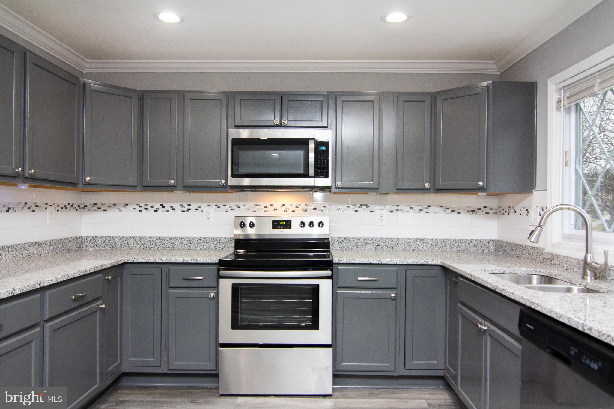 1934 Winder Road Windsor Mill, MD 21244 - Photo 10 of 31 a kitchen with cabinets stainless steel appliances and a sink