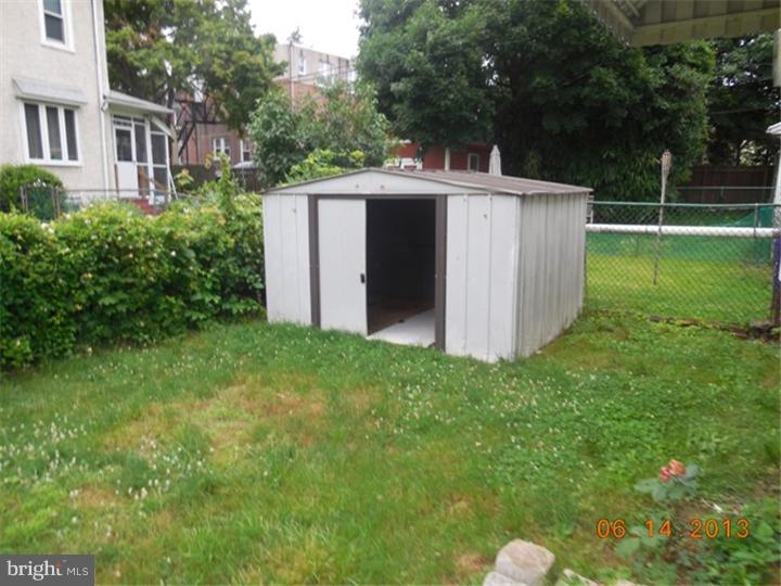 14 West Park Road Havertown, PA 19083 - Photo 15 of 15 a view of a backyard with large trees and wooden fence