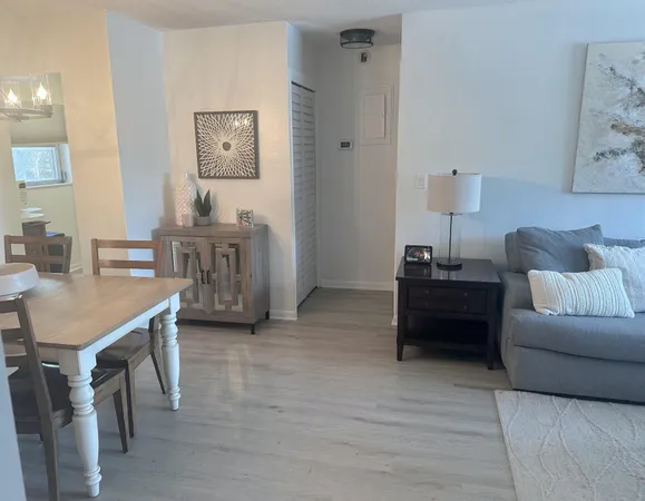 a living room with furniture and a table
