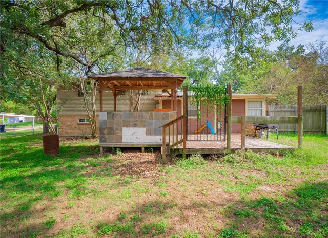 a backyard of a house with lots of green space