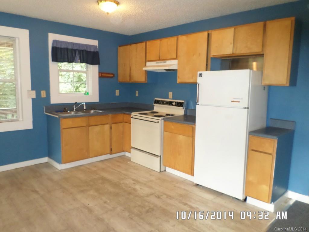 549 Pitt Street Morganton, NC 28655 - Photo 2 of 17 a kitchen with a window a sink and a refrigerator