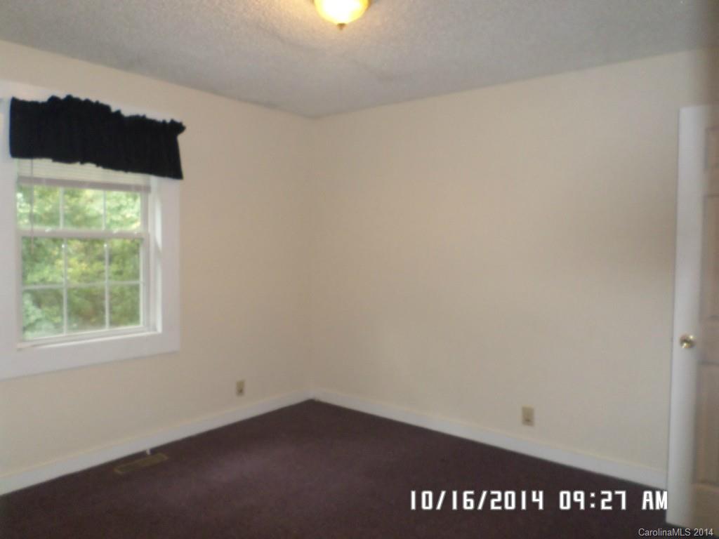 549 Pitt Street Morganton, NC 28655 - Photo 6 of 17 an empty room with a window