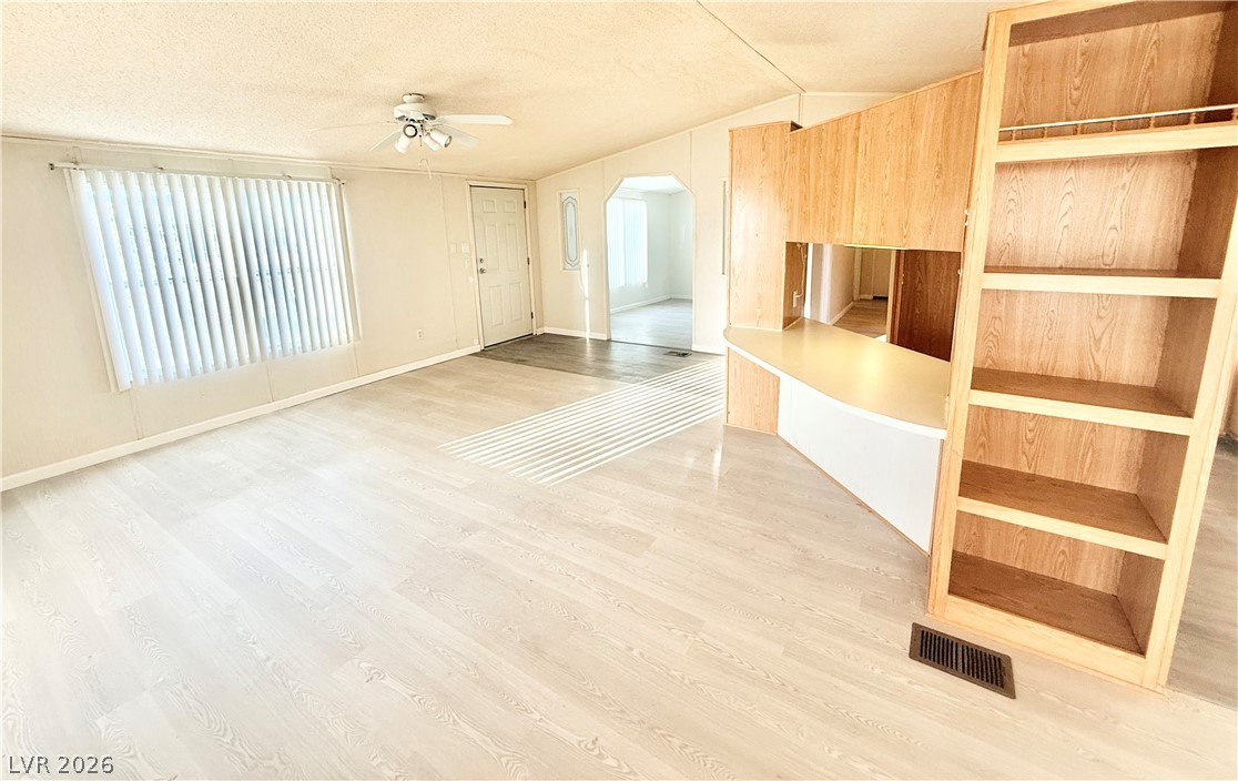 6471 Hafen Ranch Road Pahrump, NV 89061 - Photo 6 of 22 A welcoming interior with warm wood tones and bright flooring offers a comfortable living space.