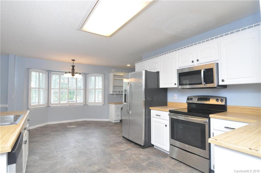 1200 Macedonia Church Road Campobello, SC 29322 - Photo 11 of 26 a kitchen with stainless steel appliances a stove microwave and refrigerator