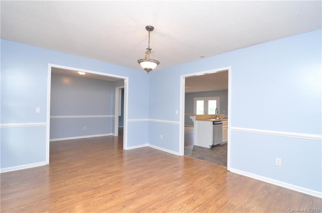 1200 Macedonia Church Road Campobello, SC 29322 - Photo 14 of 26 wooden floor in an empty room with a window
