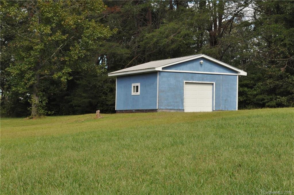 1200 Macedonia Church Road Campobello, SC 29322 - Photo 25 of 26 a front view of a house with a garden
