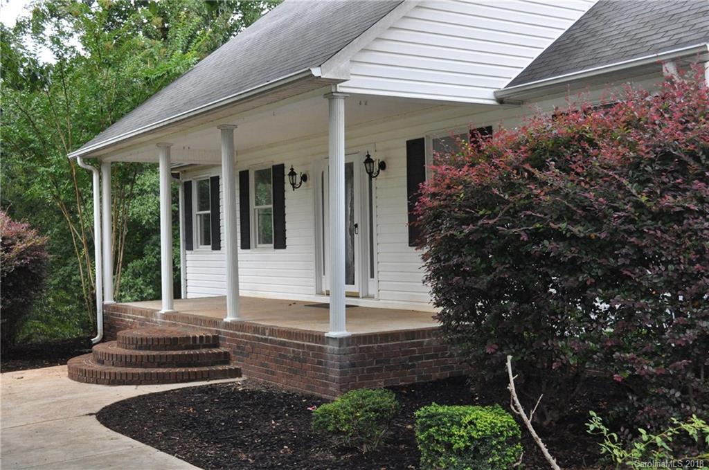 1200 Macedonia Church Road Campobello, SC 29322 - Photo 4 of 26 a front view of a house with garden