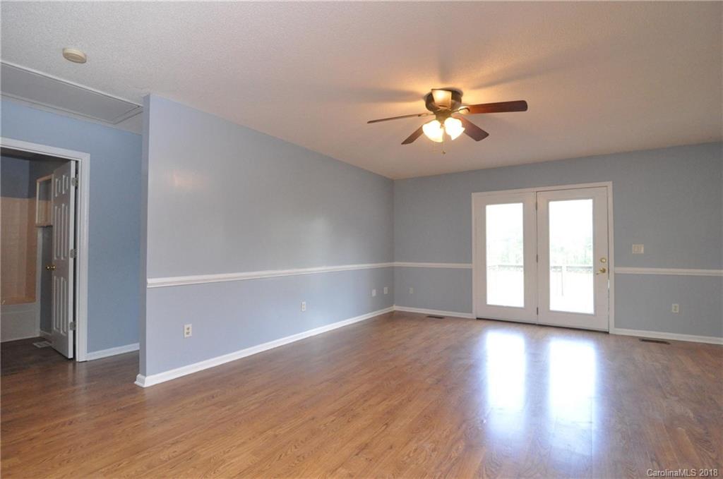 1200 Macedonia Church Road Campobello, SC 29322 - Photo 8 of 26 wooden floor in an empty room with a window