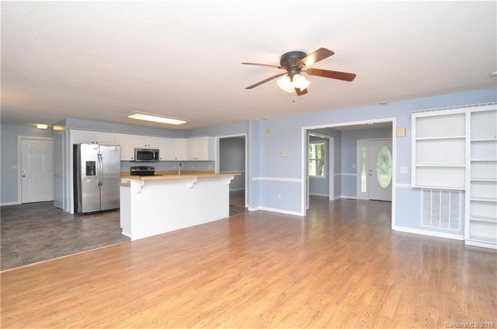 1200 Macedonia Church Road Campobello, SC 29322 - Photo 9 of 26 a view of a kitchen with a sink and a refrigerator