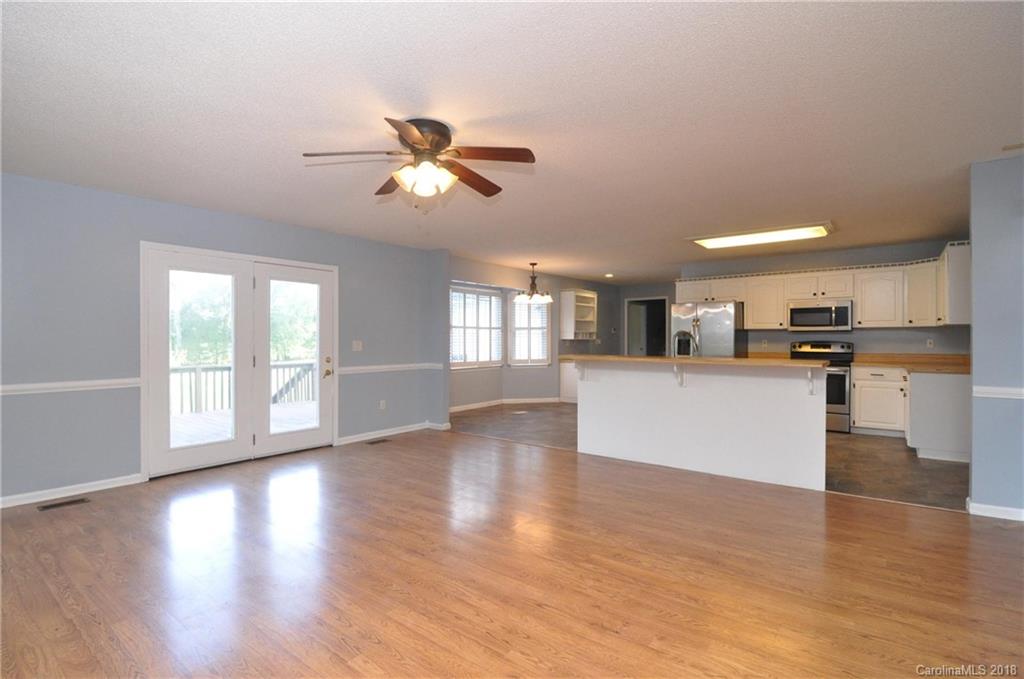 1200 Macedonia Church Road Campobello, SC 29322 - Photo 10 of 26 a view of an empty room with kitchen and window