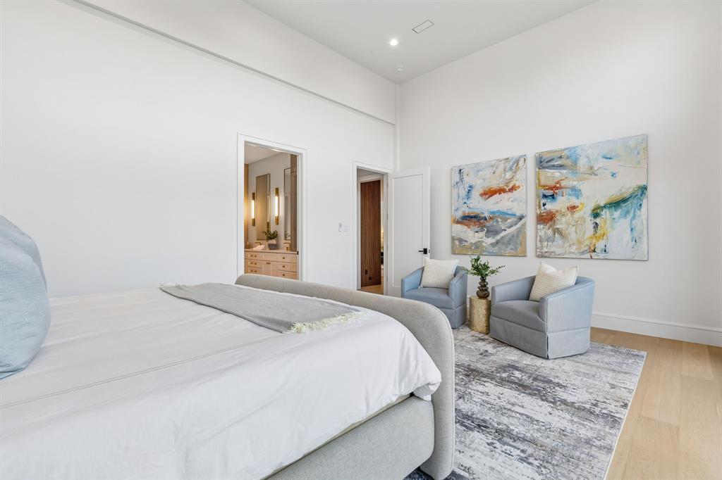 6215 Lafayette Way Dallas, TX 75230 - Photo 17 of 36 a bedroom with a bed and a couch