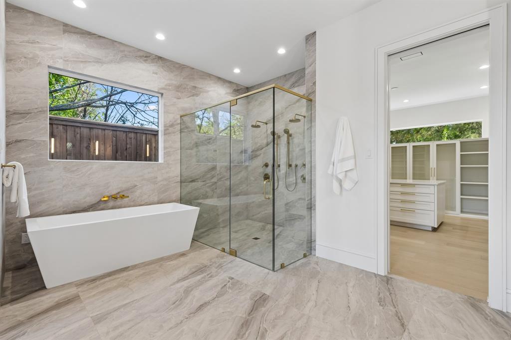 6215 Lafayette Way Dallas, TX 75230 - Photo 18 of 36 a bathroom with a bathtub and a shower
