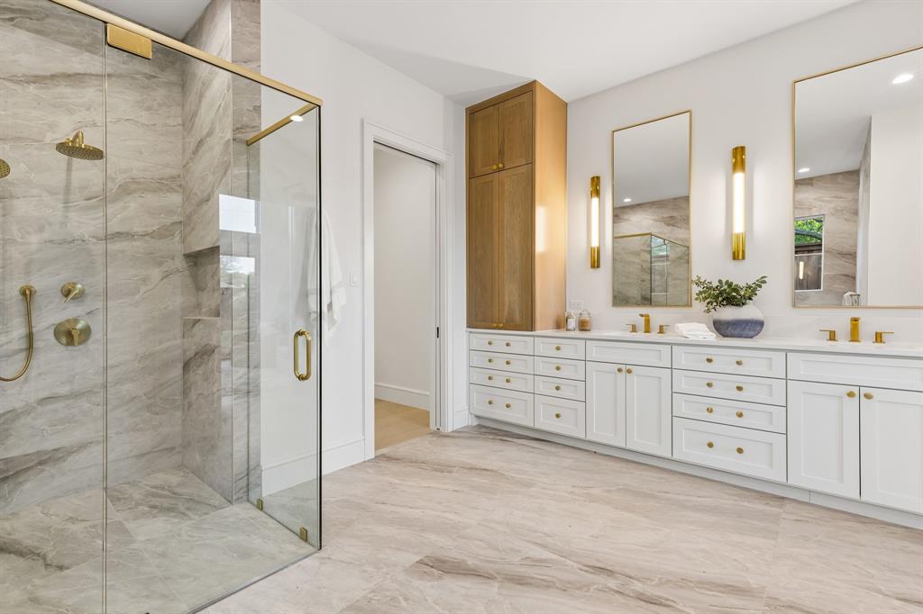 6215 Lafayette Way Dallas, TX 75230 - Photo 20 of 36 a spacious bathroom with a shower sink and mirror