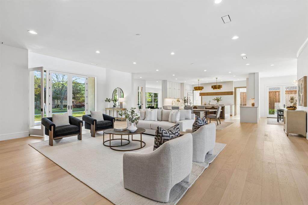 6215 Lafayette Way Dallas, TX 75230 - Photo 6 of 36 a living room with furniture kitchen view and a large window