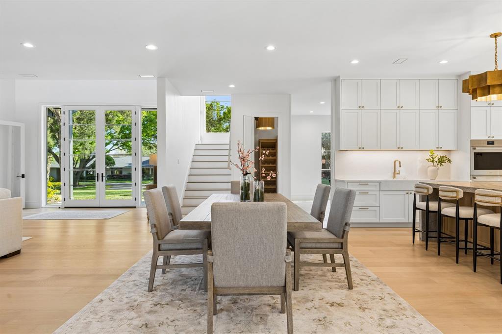 6215 Lafayette Way Dallas, TX 75230 - Photo 7 of 36 a view of a dining room with furniture window and wooden floor