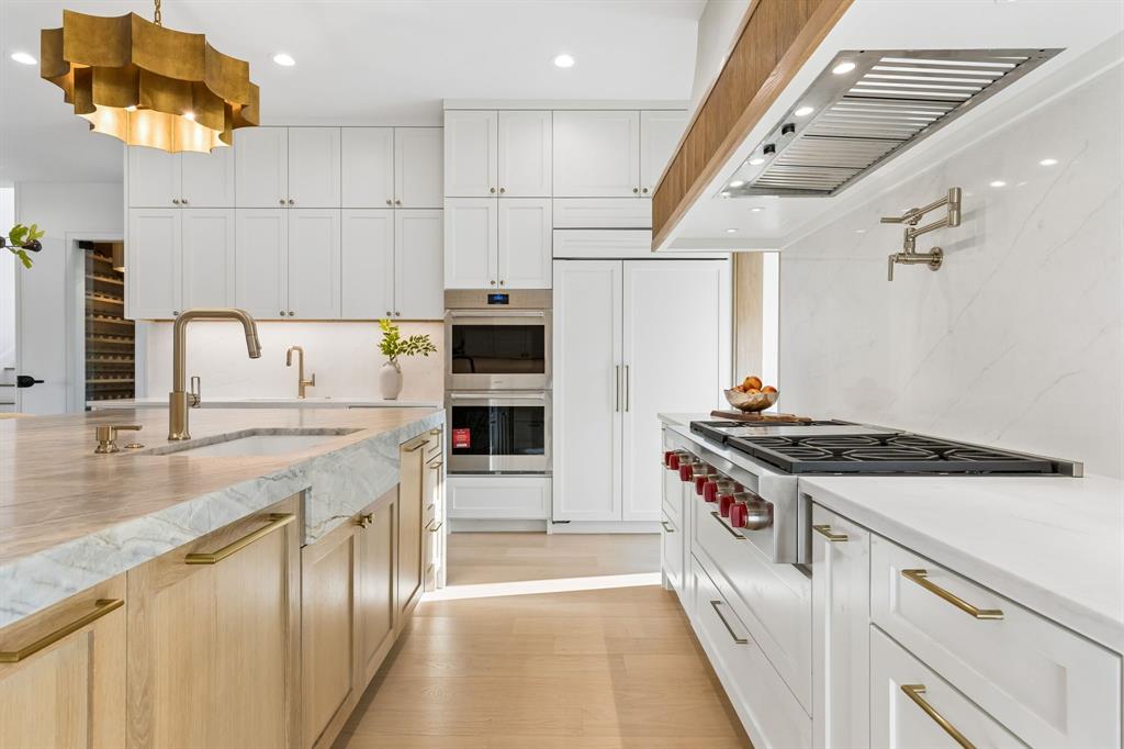 6215 Lafayette Way Dallas, TX 75230 - Photo 10 of 36 a kitchen with stainless steel appliances granite countertop a stove a sink dishwasher and a refrigerator