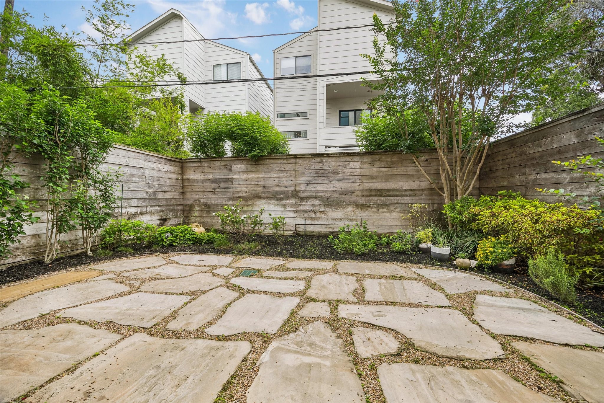 1526 Vermont Street Houston, TX 77006 - Photo 10 of 39 Spacious backyard patio with multiple access points and room for dining, lounging, or gardening.