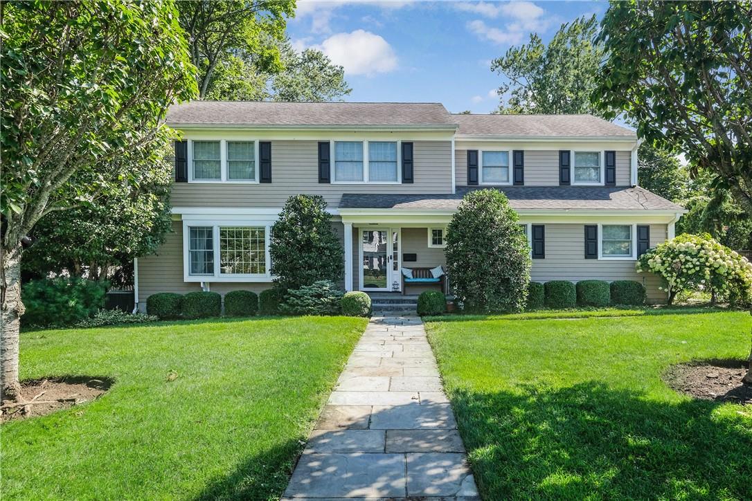 5 Willetts Road Harrison, NY 10528 - Photo 1 of 1 a front view of a house with a yard and porch