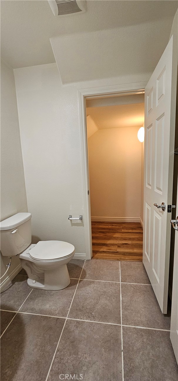 8652 Cava Drive Rancho Cucamonga, CA 91730 - Photo 16 of 44 a bathroom with a toilet and a shower