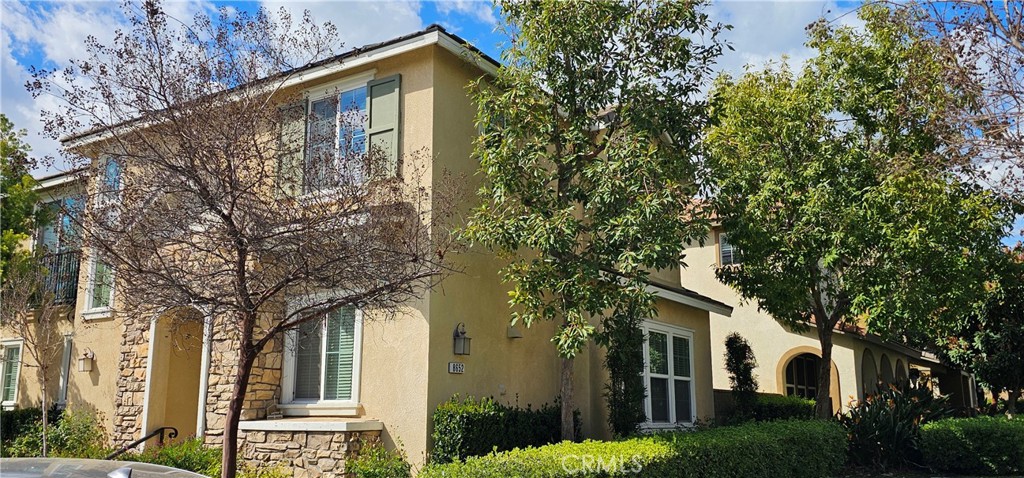 8652 Cava Drive Rancho Cucamonga, CA 91730 - Photo 2 of 44 a front view of a house with garden