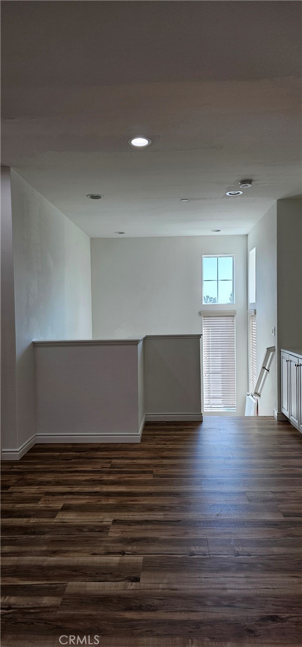 8652 Cava Drive Rancho Cucamonga, CA 91730 - Photo 21 of 44 a view of empty room with wooden floor