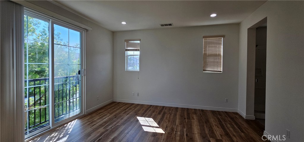 8652 Cava Drive Rancho Cucamonga, CA 91730 - Photo 22 of 44 a view of empty room with wooden floor and fan