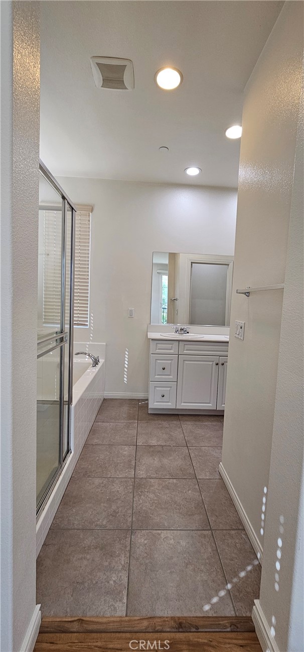 8652 Cava Drive Rancho Cucamonga, CA 91730 - Photo 25 of 44 a view of a hallway to kitchen and wooden floor