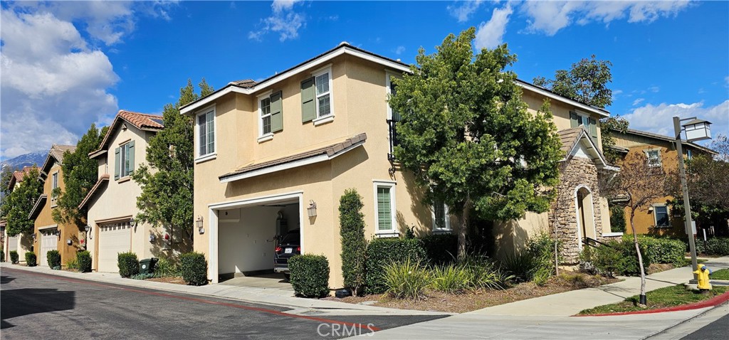 8652 Cava Drive Rancho Cucamonga, CA 91730 - Photo 3 of 44 a front view of a house with garden