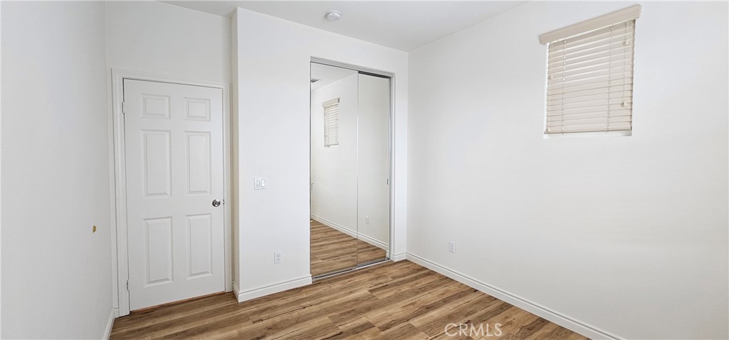 8652 Cava Drive Rancho Cucamonga, CA 91730 - Photo 33 of 44 a view of a room with wooden floor and closet
