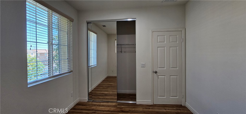8652 Cava Drive Rancho Cucamonga, CA 91730 - Photo 34 of 44 a view of a livingroom with wooden floor and window