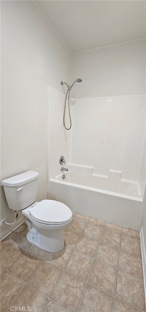 8652 Cava Drive Rancho Cucamonga, CA 91730 - Photo 38 of 44 a bathroom with a toilet and a shower