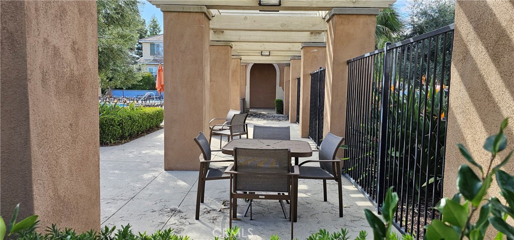 8652 Cava Drive Rancho Cucamonga, CA 91730 - Photo 43 of 44 a view of a patio with table and chairs and potted plants