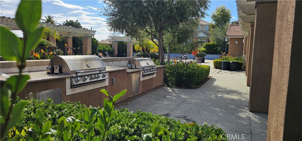 8652 Cava Drive Rancho Cucamonga, CA 91730 - Photo 44 of 44 a view of a patio with chairs and potted plants
