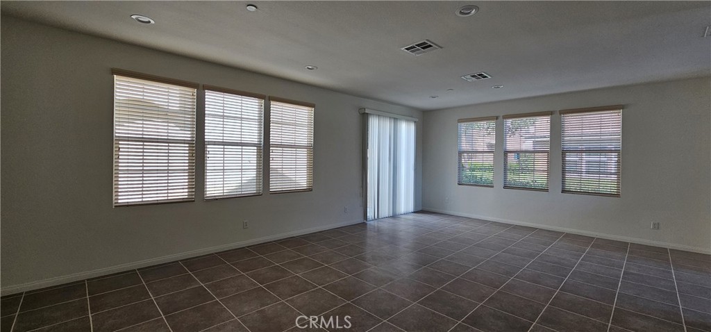 8652 Cava Drive Rancho Cucamonga, CA 91730 - Photo 8 of 44 a view of an empty room with a window